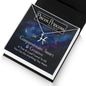 Overhead view of a Stainless Steel Pisces Necklace in standard Box