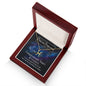 Overhead side view of a Gold Pisces Necklace in Mahogany Style Box